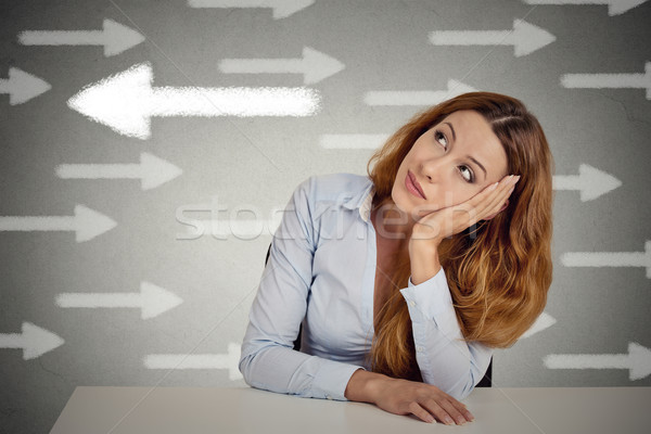 Thoughtful woman taking a chance going against flow Stock photo © ichiosea