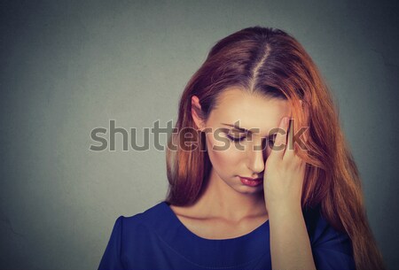 sad young beautiful woman with worried stressed face expression looking down Stock photo © ichiosea