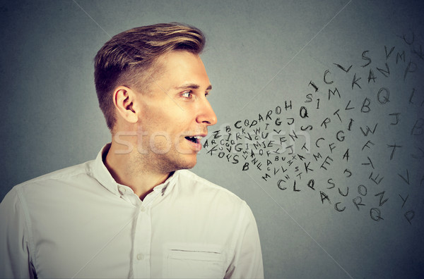 Man talking with alphabet letters coming out of his mouth Stock photo © ichiosea