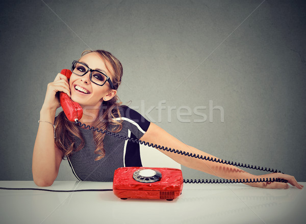 Happy funny looking young woman calling someone Stock photo © ichiosea