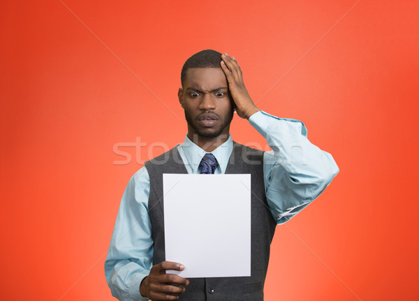 Man holding paper, statement, shocked with bad news Stock photo © ichiosea