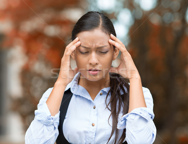 Stock photo: Stressed woman having headache