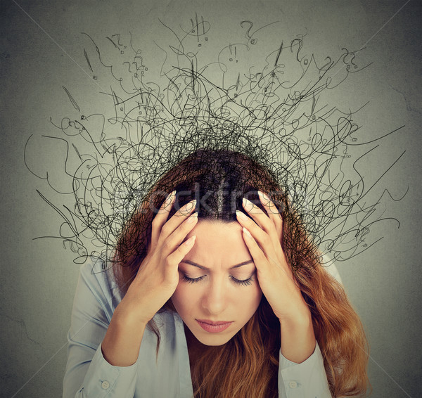 sad young woman with worried stressed face expression and brain melting into lines  Stock photo © ichiosea