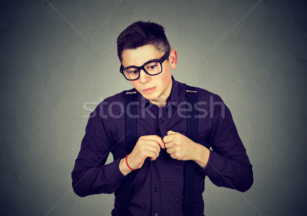 man in unpleasant awkward situation playing nervously with hands  Stock photo © ichiosea
