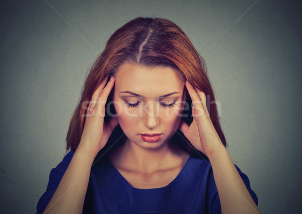 sad young beautiful woman with worried stressed face expression looking down Stock photo © ichiosea
