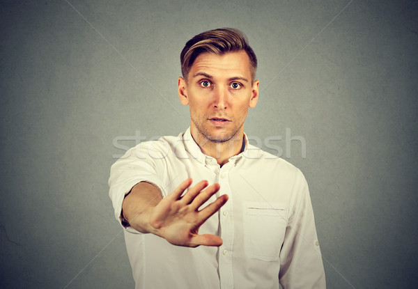young man with stop hand gesture  Stock photo © ichiosea