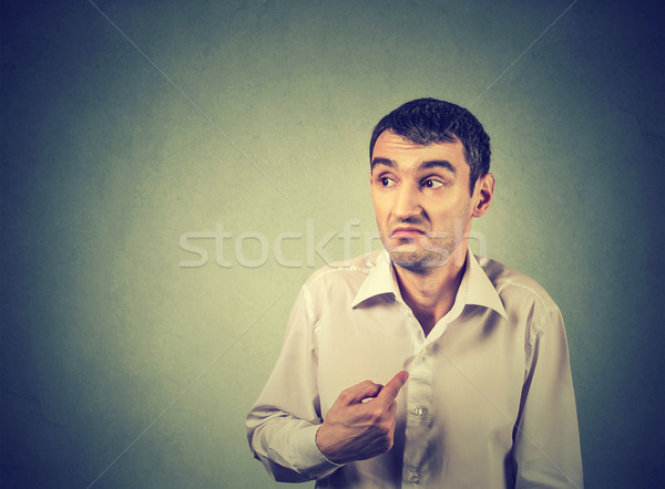 young guy pointing at himself you mean me  Stock photo © ichiosea