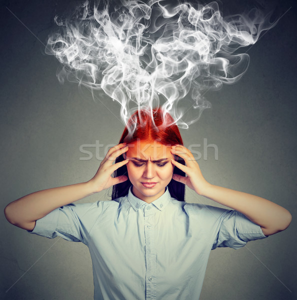 Woman thinks very intensely having headache  Stock photo © ichiosea