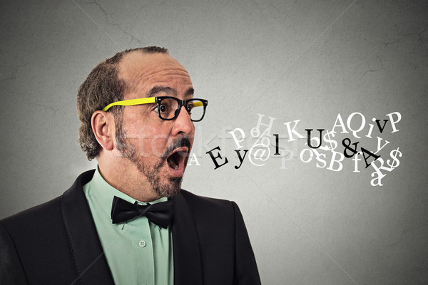 man talking symbols alphabet letters coming out of mouth Stock photo © ichiosea