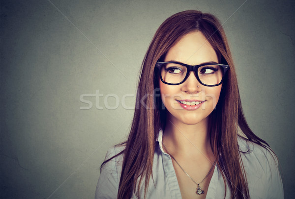 Excited woman looking sideways smiling.  Stock photo © ichiosea