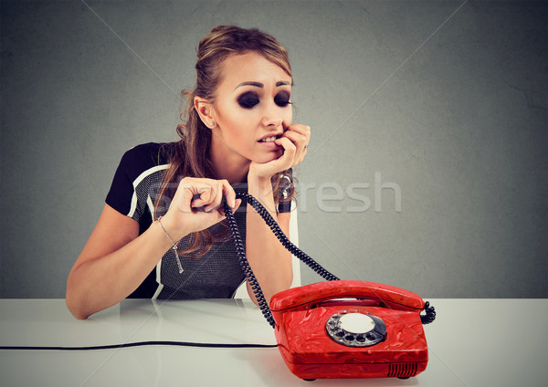 Young sad woman waiting for a call Stock photo © ichiosea