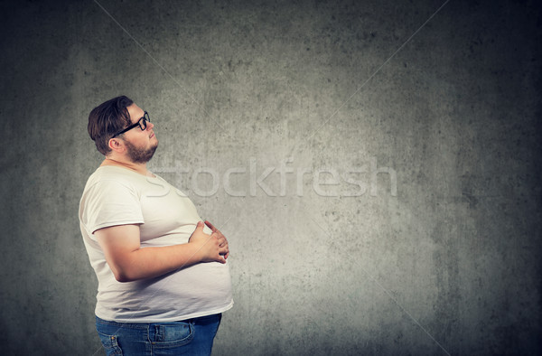 Stock photo: Overweight man with big belly 