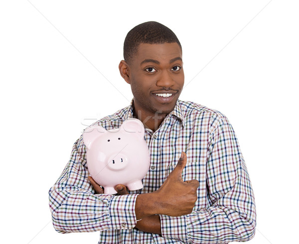 smiling student holding piggy bank giving thumbs up Stock photo © ichiosea