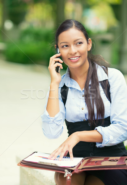 Business woman analyzing documents, talking on mobile phone Stock photo © ichiosea