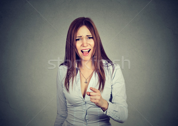 angry woman pointing at camera Stock photo © ichiosea