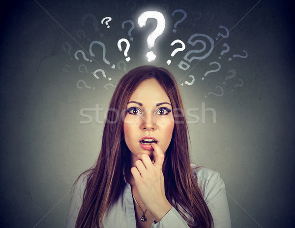 Surprised woman with many questions and no explanation or answer   Stock photo © ichiosea