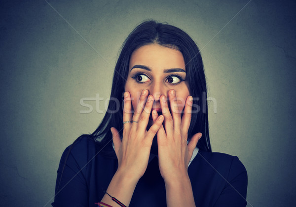 Portrait of surprised shocked girl covering mouth with hands.  Stock photo © ichiosea