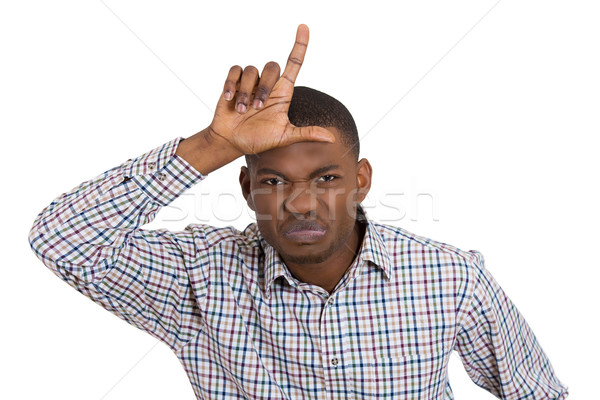 funny young man displaying loser sign Stock photo © ichiosea