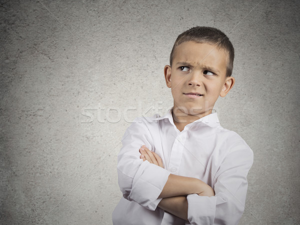 Stock photo: suspicious, cautious child boy looking with disbelief