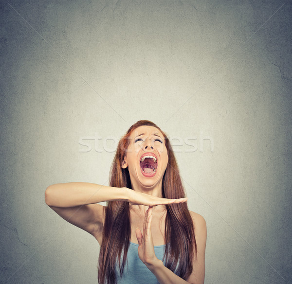 Young woman showing time out hand gesture, frustrated screaming Stock photo © ichiosea