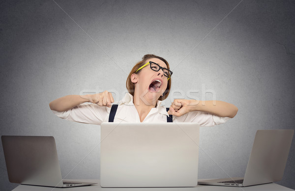 Yawning business woman sitting at desk with computers Stock photo © ichiosea