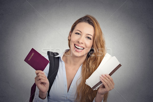 happy tourist young woman holding passport holiday flight ticket  Stock photo © ichiosea