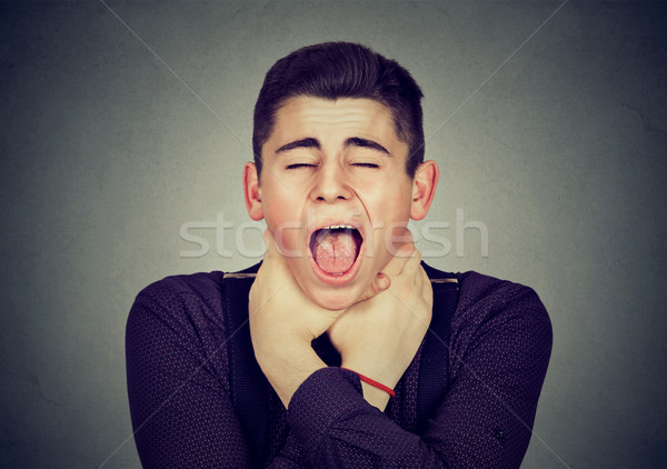 Stock photo: man having asthma attack or choking can't breath