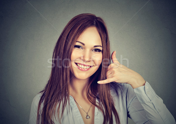 Portrait woman making dial my number sign with hand like phone  Stock photo © ichiosea