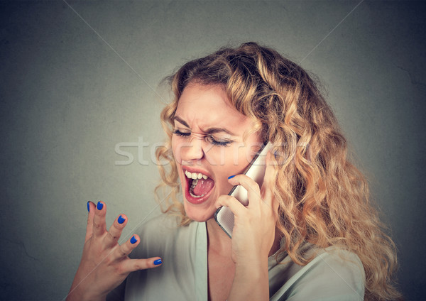 woman screaming on mobile phone Stock photo © ichiosea