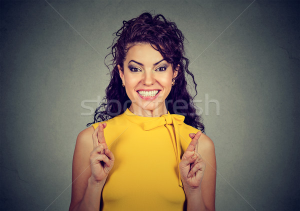 Stock photo: woman crossing her fingers, hoping, making a wish