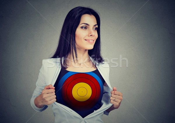 Determined business woman showing a target under her shirt Stock photo © ichiosea
