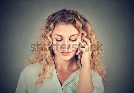 Young sad woman talking on mobile phone Stock photo © ichiosea