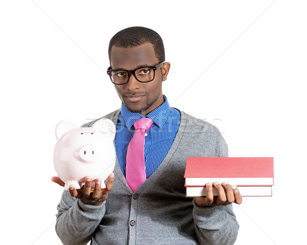 Man holding books and piggy bank Stock photo © ichiosea