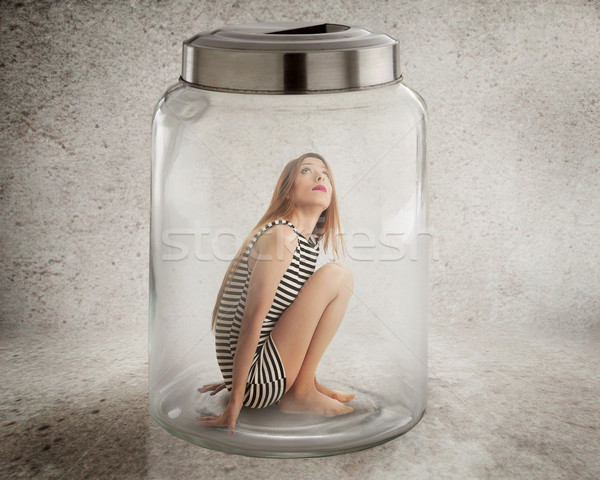 Young lonely woman sitting in glass jar  Stock photo © ichiosea