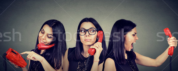 woman dialing number on vintage telephone curiously listening and getting angry screaming on the pho Stock photo © ichiosea