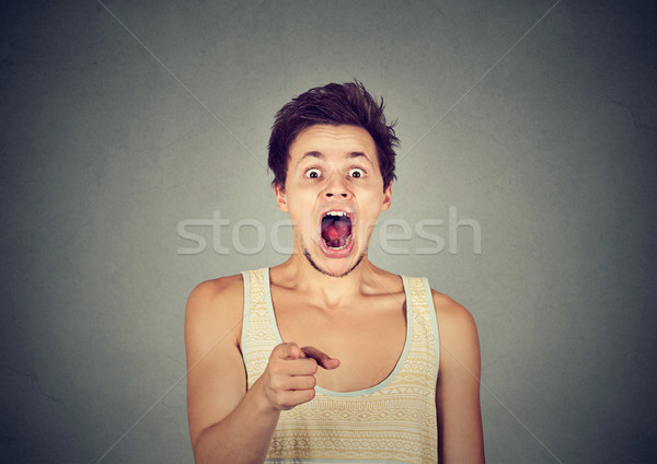 surprised shocked man pointing finger at camera  Stock photo © ichiosea