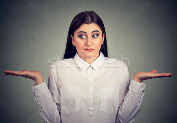 young woman with arms out shrugs shoulders has no answer   Stock photo © ichiosea