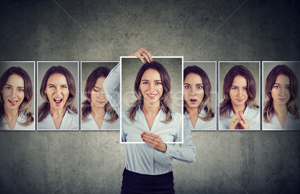 Stock photo: Young woman expressing different emotions 