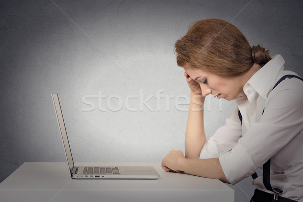Depressed woman in front of laptop Stock photo © ichiosea