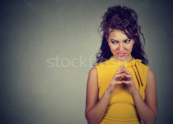 Ravasz fiatal nő valami néz izolált szürke Stock fotó © ichiosea