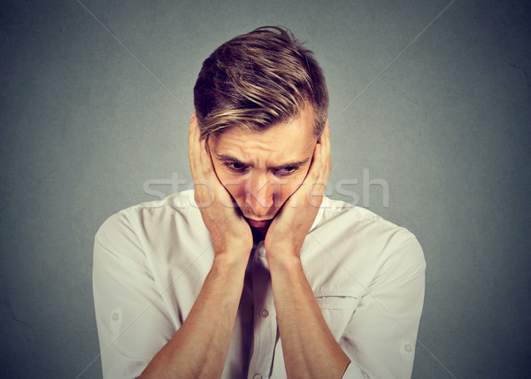 sad man with worried stressed face expression looking down Stock photo © ichiosea