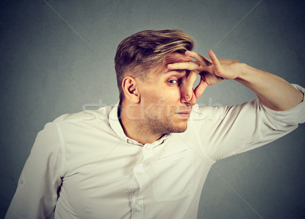 man pinches nose looks with disgust something stinks bad smell Stock photo © ichiosea