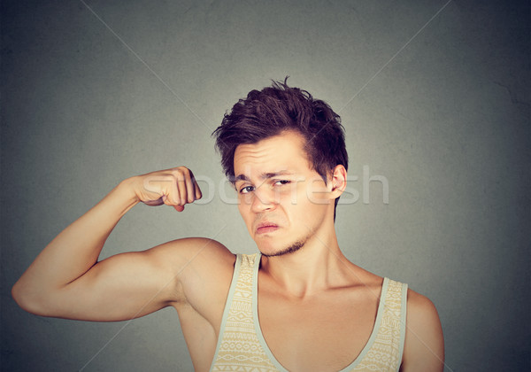 Funny sport man flexing his biceps  Stock photo © ichiosea