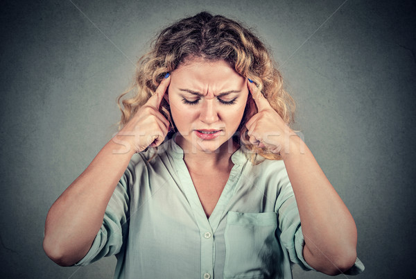 sad young woman with worried stressed face expression looking down Stock photo © ichiosea