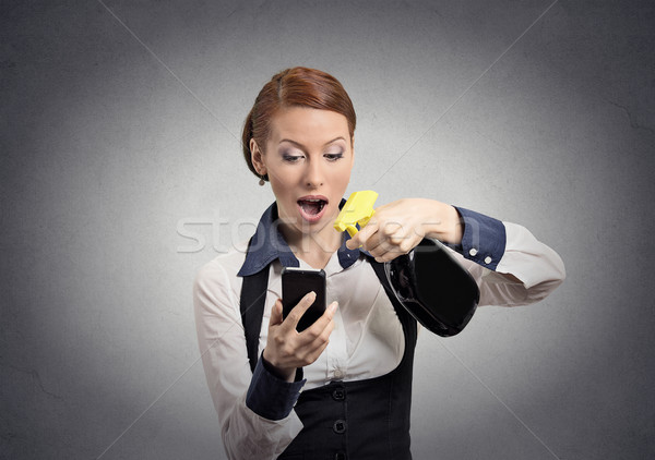 woman holding smartphone and cleaning spray bottle for glass  Stock photo © ichiosea