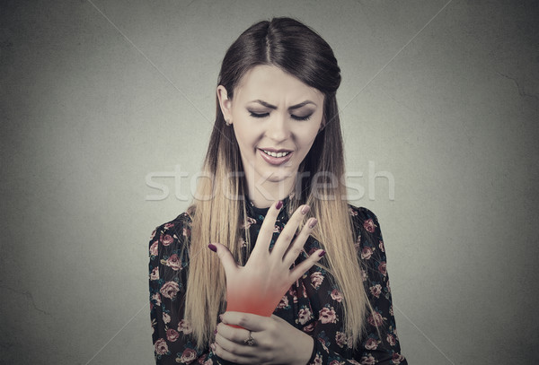 Nő tart fájdalmas csukló fiatal nő színes Stock fotó © ichiosea