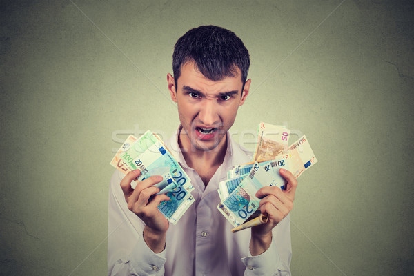Ganancioso homem euro notas isolado Foto stock © ichiosea