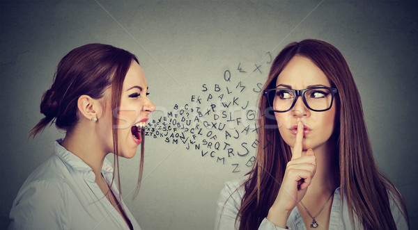 Angry woman screaming at herself with quiet finger on lips gesture Stock photo © ichiosea