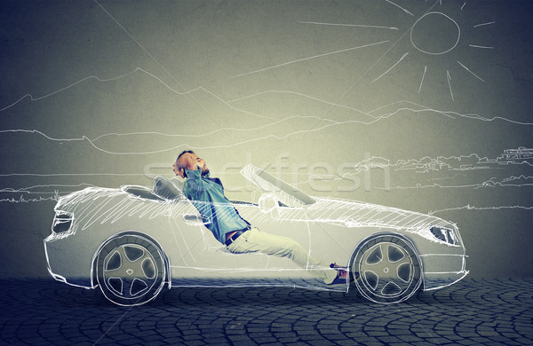 Side profile young business man relaxes in his driverless car  Stock photo © ichiosea