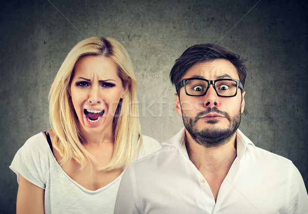 Angry mad woman screaming and fearful man Stock photo © ichiosea